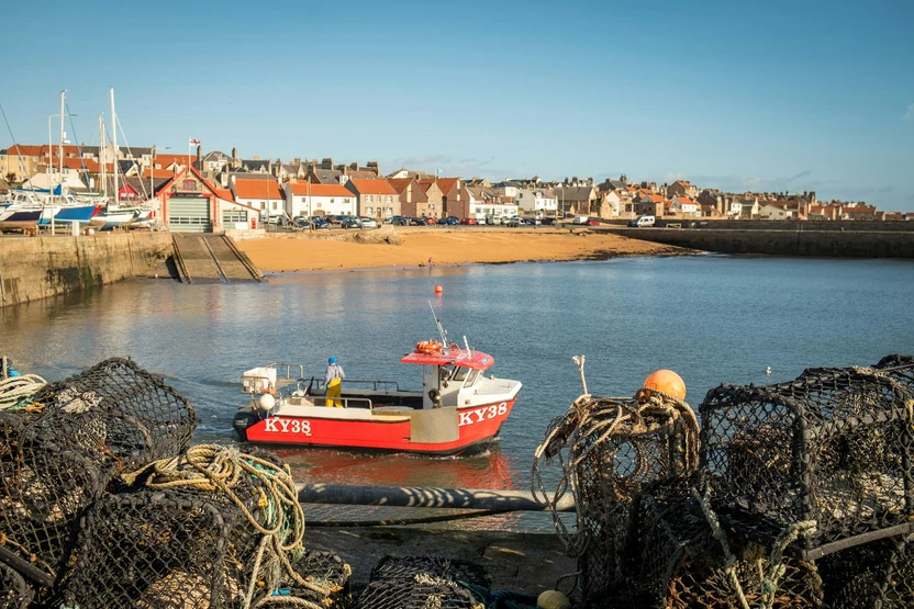 A fisherman working in a dock in Anstruther Fife